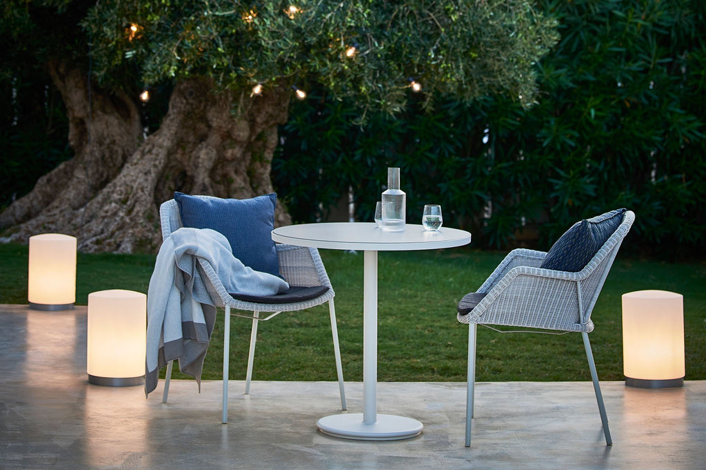 Small outdoor furniture with comfortable chairs and cafe table