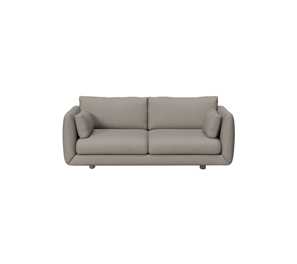 Hellbraunes modernes Sofa mit runden Kissen in einer Lounge-Umgebung.