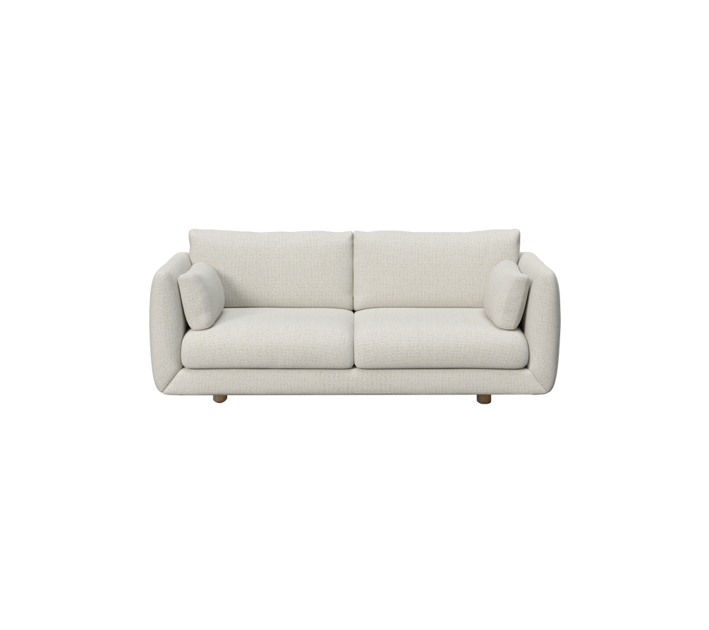Moderne Sandsofa mit runden Kissen und Holzbeinen.
