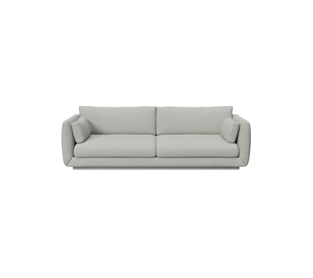 Hellgraues modernes Sofa mit runden Kissen.