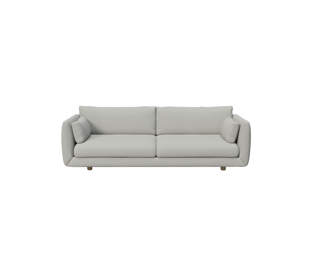 Hellgraues modernes Sofa mit runden Kissen.