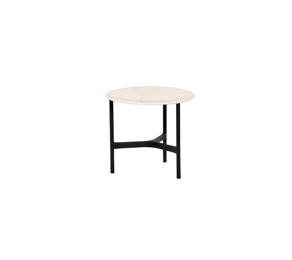 Runder Tisch mit einer schlichten, hellen Tischplatte und schwarzen Metallbeinen, ideal für moderne und minimalistische Einrichtungen.