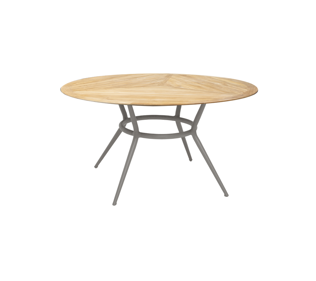 Taupe runde Tisch mit einem einfachen Design und schlanken Beinen.