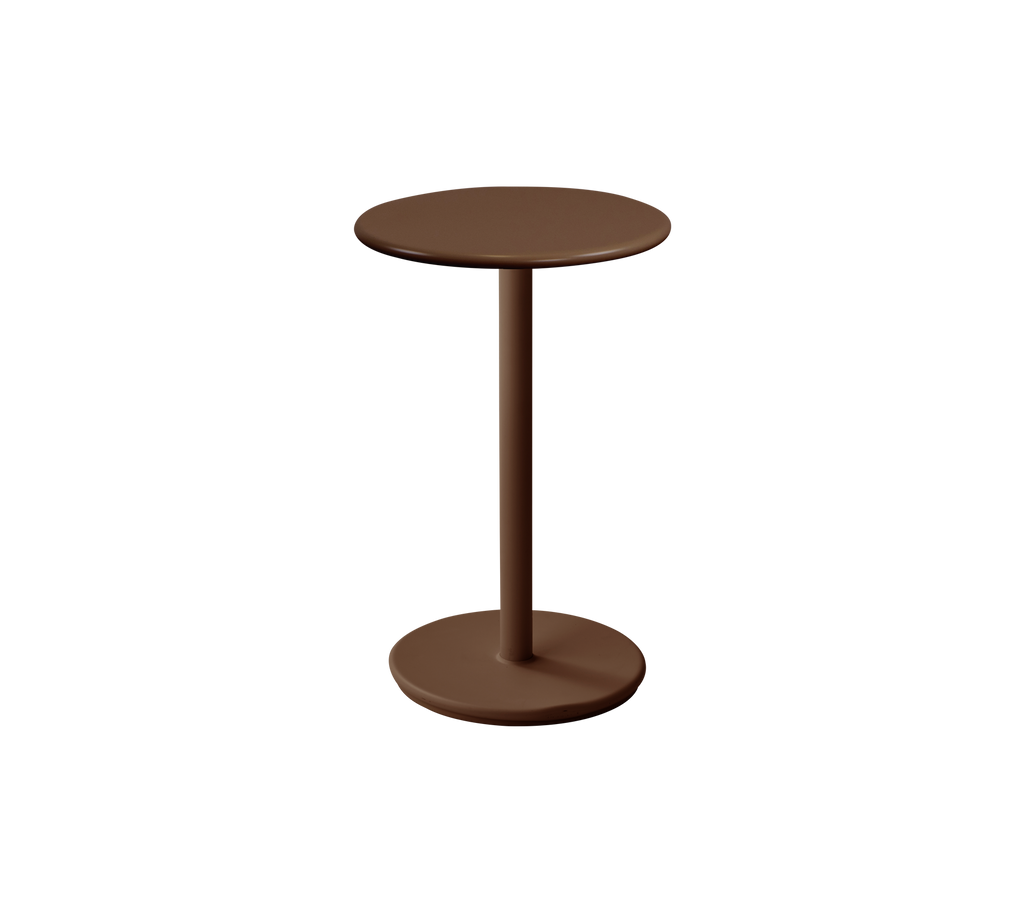 Modern runder Tisch in wüstenroter Farbe.