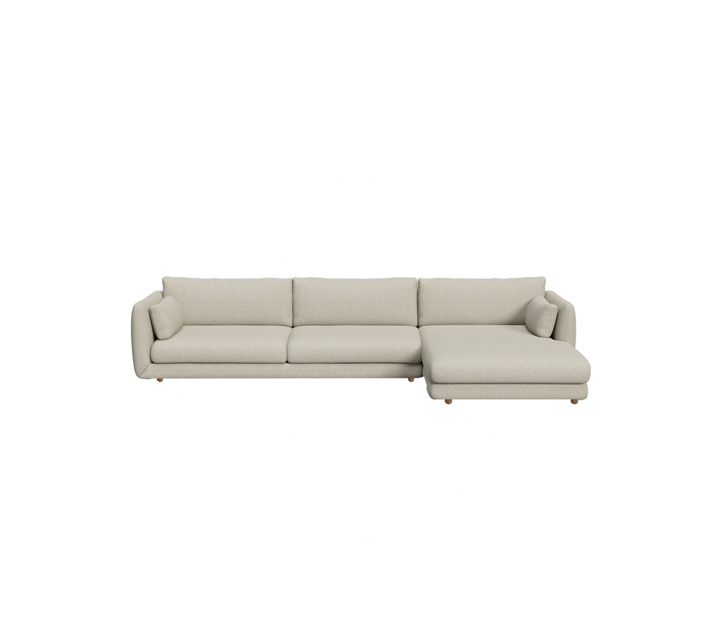 Hellbraunes Ecksofa in einem modernen Lounge-Setting.