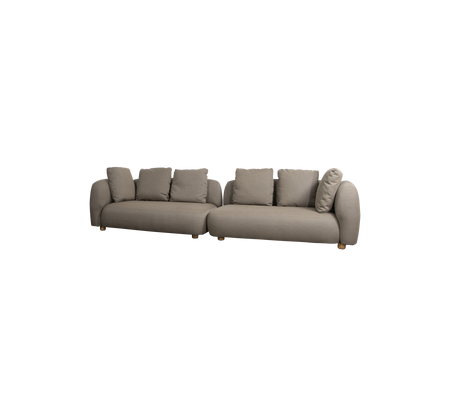Moderne L-förmiges Sofa in einem neutralen Farbton, mit weichen Kissen und abgerundeten Armlehnen, ideal für bequemes Sitzen.